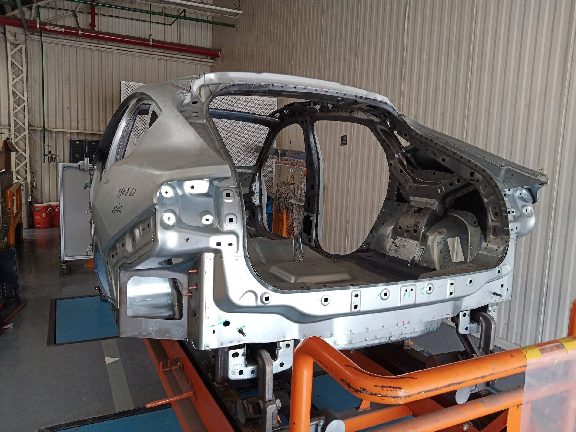 Ford Mustang Mach-E Naked Mach-E shell / frame (body in white) and Iconic Silver Preproduction seen in Mexico factory Mustang Mach-E Shell Frame Mexico Factory 4