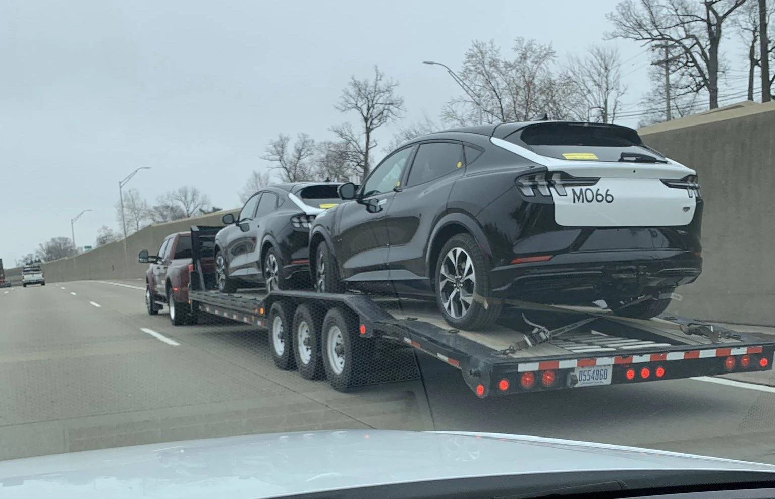 Ford Mustang Mach-E Couple black / white prototypes being transported mach-e-prototypes
