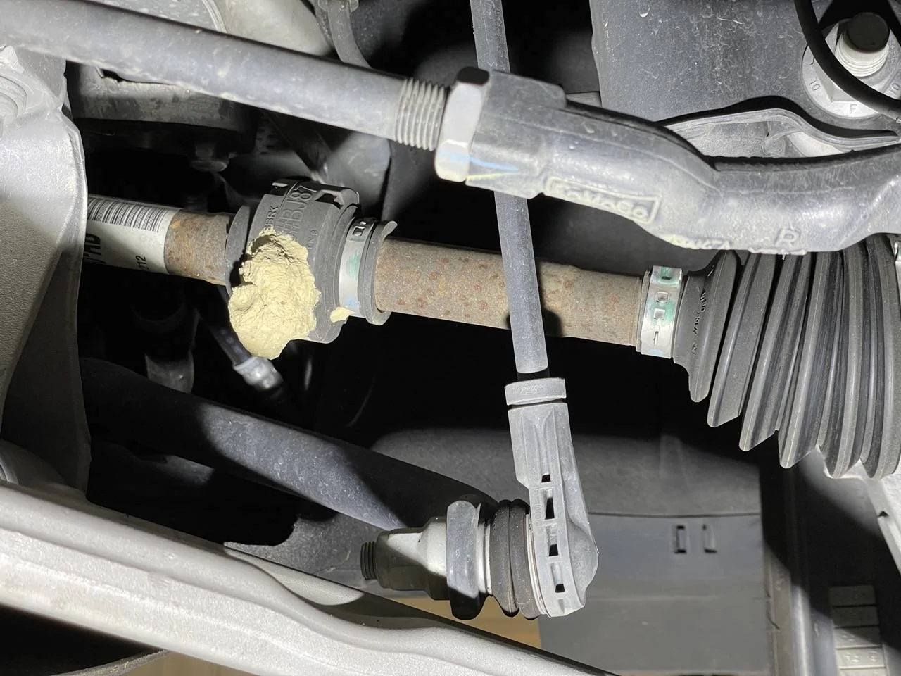 Ford Mustang Mach-E Mud dauber nest on CV axle Mud dauber Mach-E