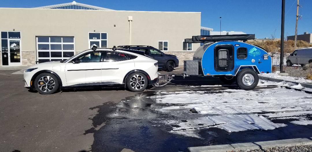 Ford Mustang Mach-E SPRING UPDATE - Towing a teardrop camper from Colorado to Virginia - 3,000 miles (through snow) in January 2024   :-D Mach E towing a teardrop camper - hooking up for the tow in Grand Junction, Colorado - sun side