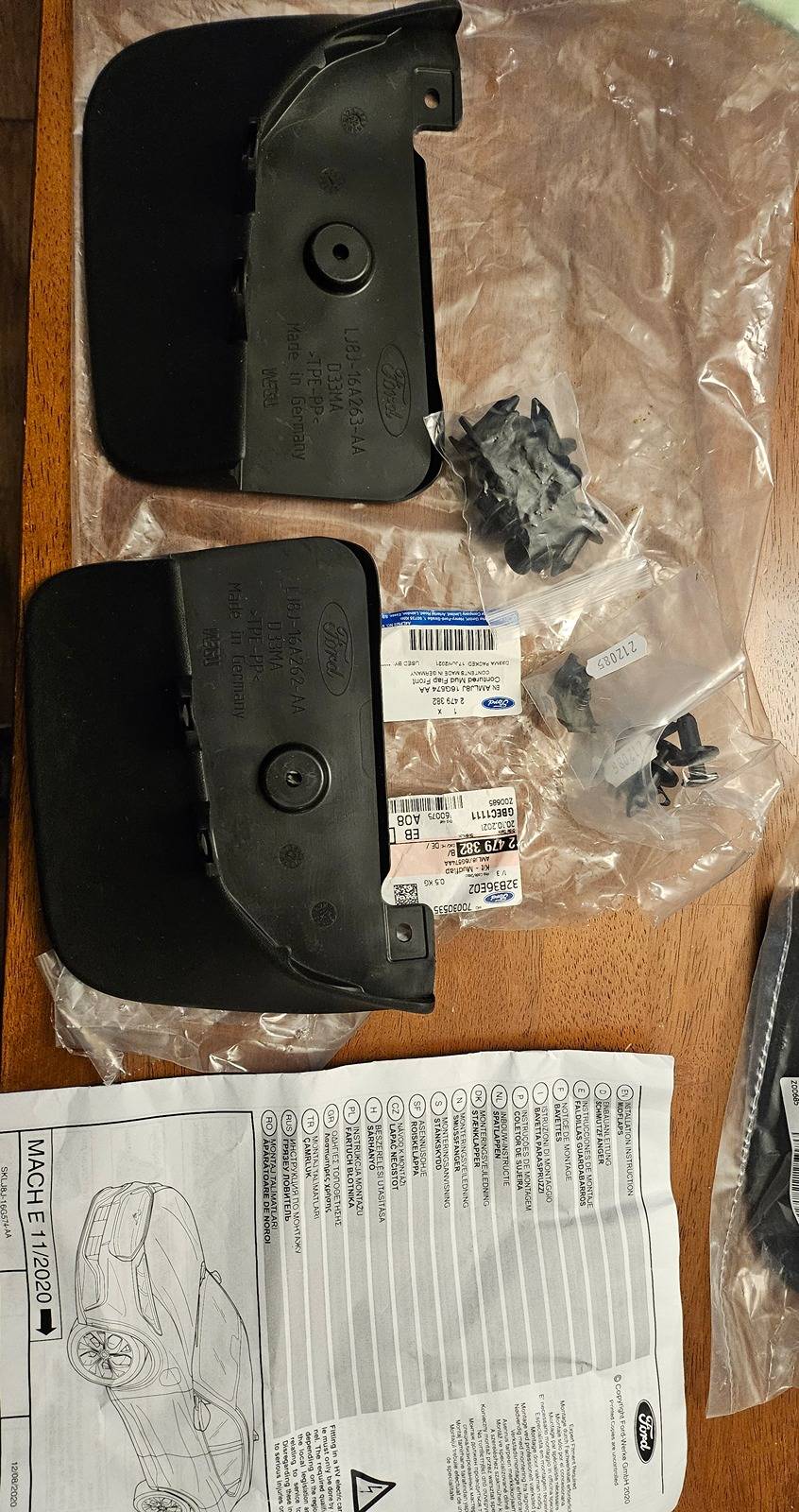 Ford Mustang Mach-E AOSK vs OEM Mud Flaps Comparison (not installed) 20240312_202140