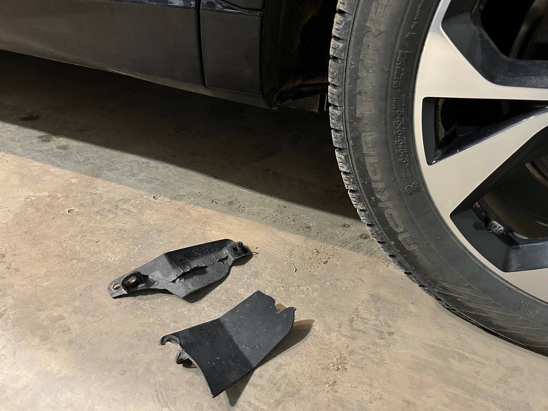 Ford Mustang Mach-E Installed Splash Guards after found OEM piece in front of rear wheel failed IMG_0429