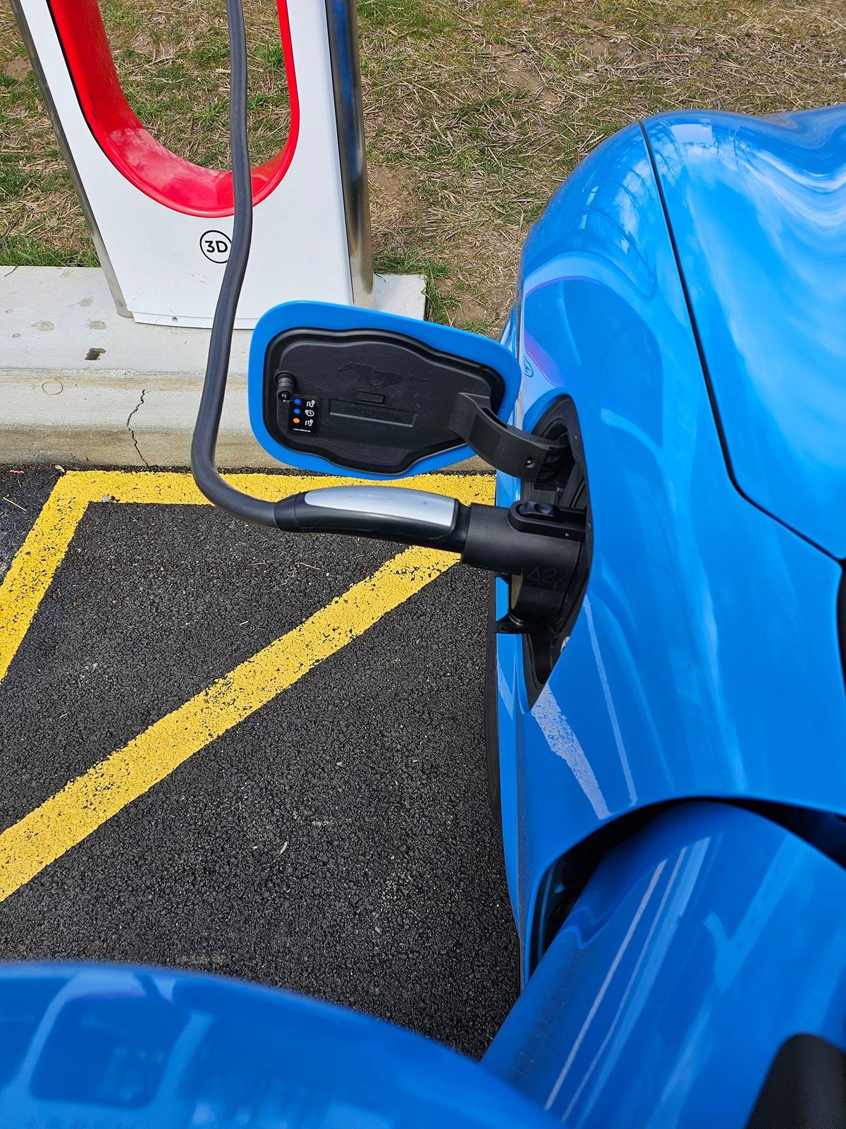 Ford Mustang Mach-E Charged Mach-E at Tesla Supercharger via Adapter 20240317_130855