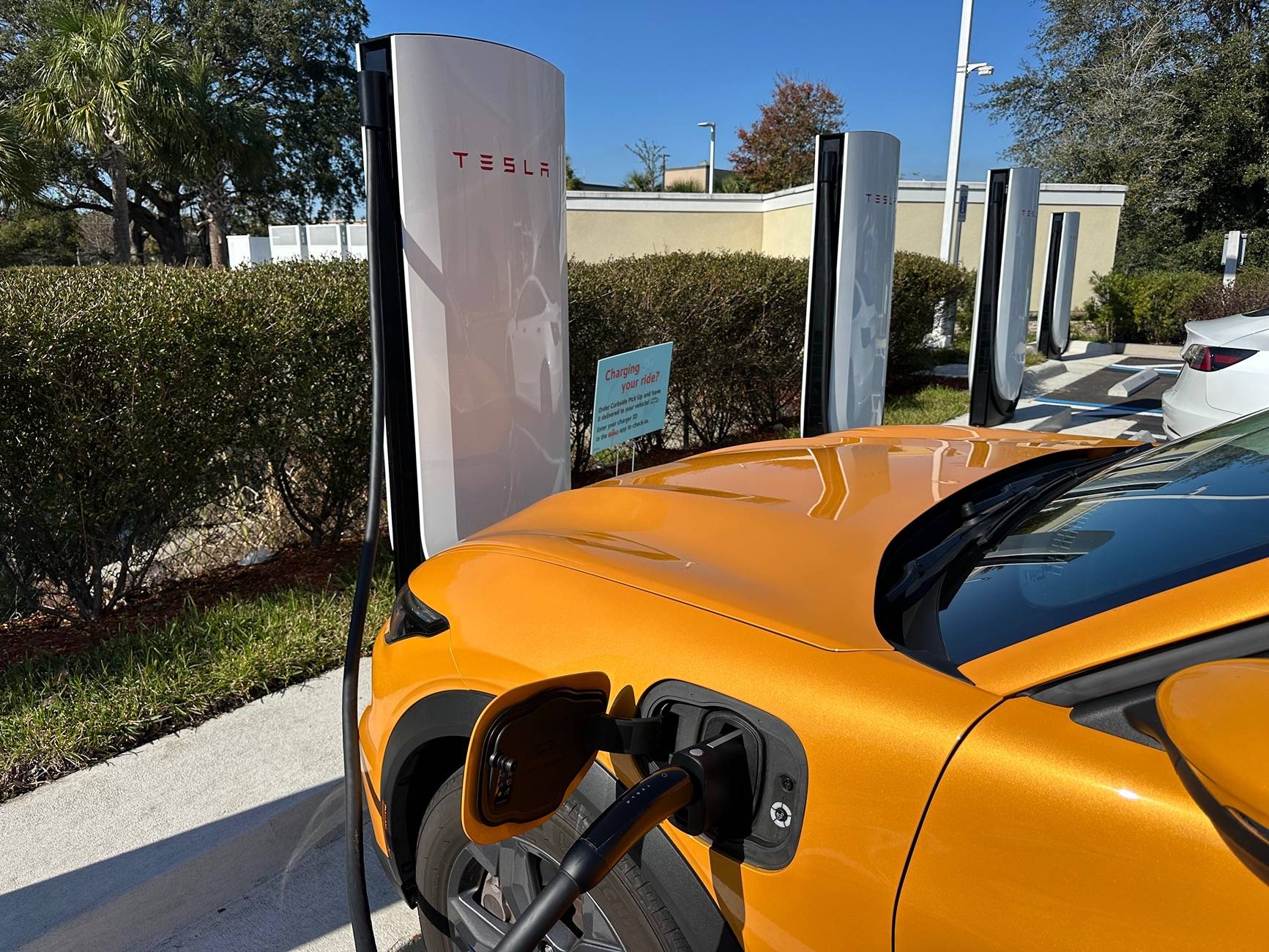 Ford Mustang Mach-E Stopped at a Tesla V4 station IMG_2757