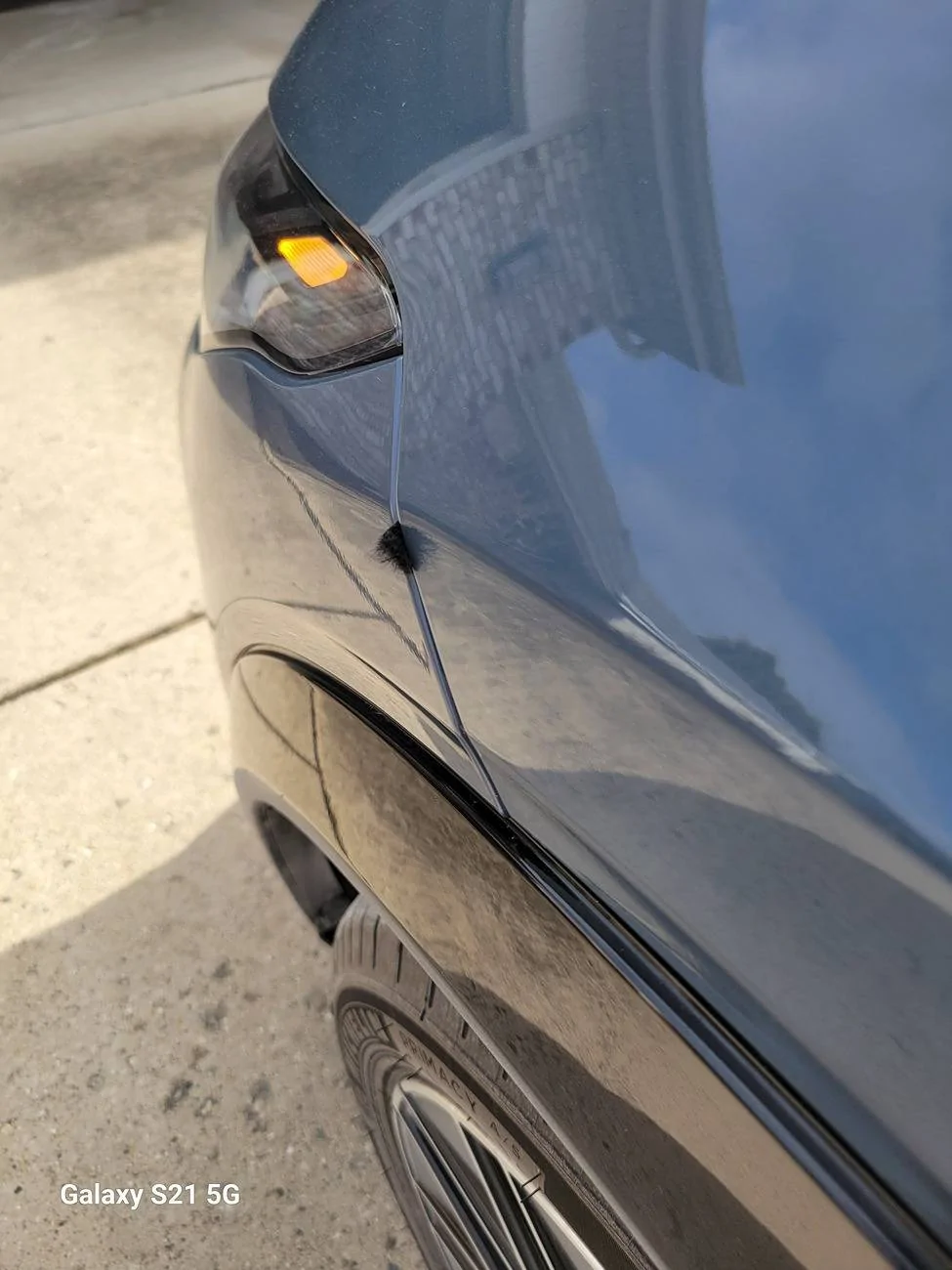 Ford Mustang Mach-E What is this piece of cloth sticking out if front panel? 20250209_104525