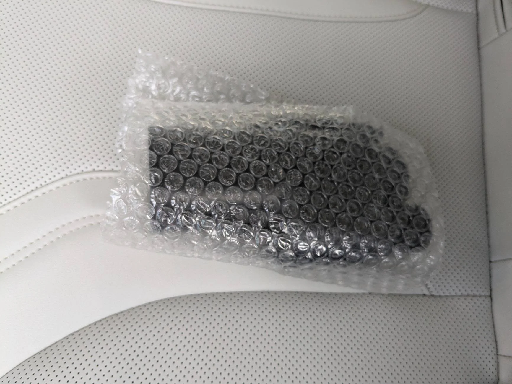 Ford Mustang Mach-E NACS adapter holder for center console (3D print) 3. Adapter in Bubble Wra