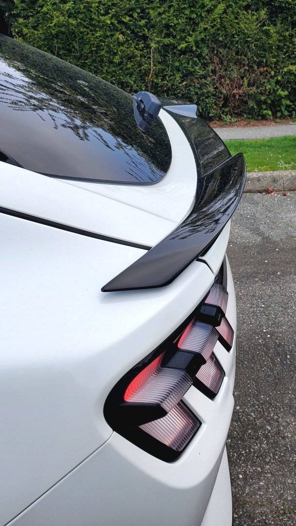 Ford Mustang Mach-E STAR WHITE METALLIC Mach-E Photos Rear Spoiler side view 1080
