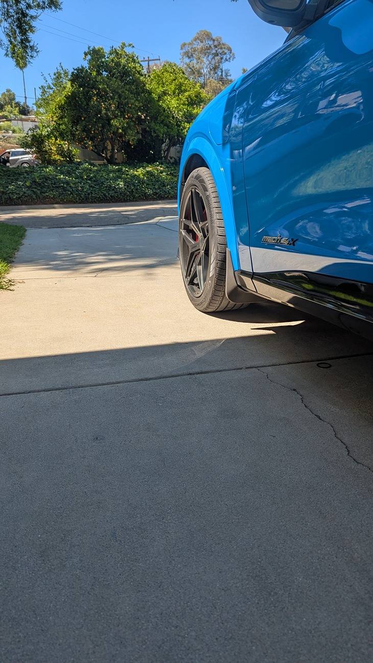 Ford Mustang Mach-E Finally installed some goodies: side louvers, mud flaps and front splitter PXL_20250629_171100643