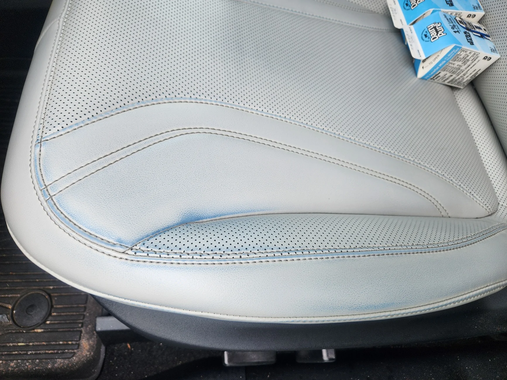 Ford Mustang Mach-E Dye transfer on light gray leather 1000015185