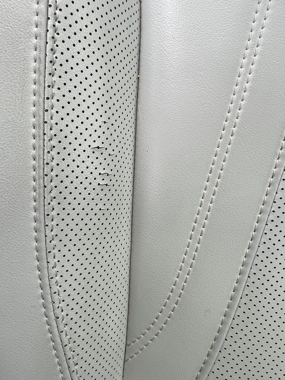 Ford Mustang Mach-E Driver seat leather tearing in just 39K miles IMG_0320
