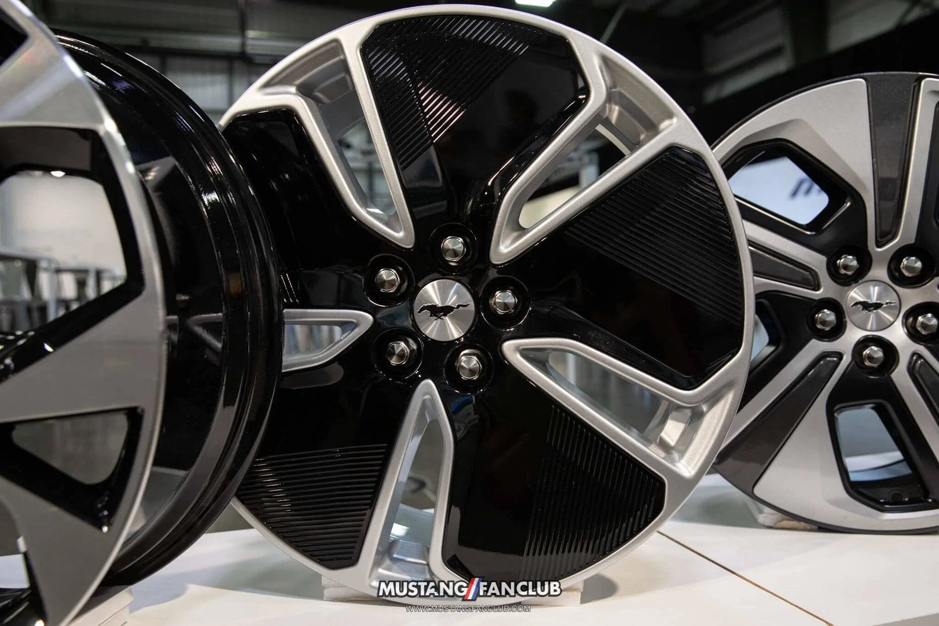 Ford Mustang Mach-E Closeup Looks at Mach-E Factory Wheels Options, Seats, Stitching, Cabin Environment 2021 Mach-E 19″ Shadow Silver Aluminum Wheel w: Black Painted Aero Cover (Included in Comfort