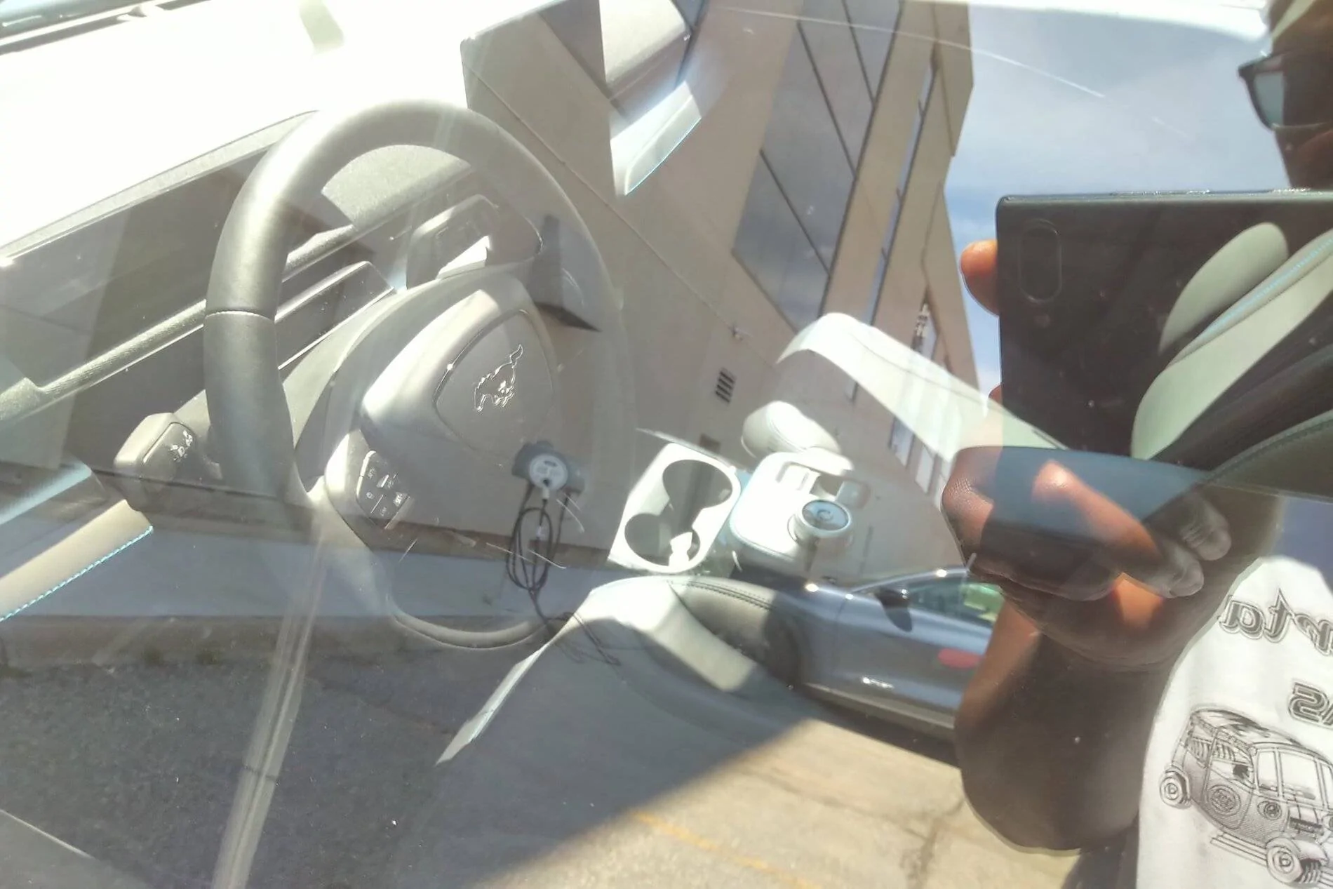 Ford Mustang Mach-E Mach E spotted charging beside a Model Y EeXJBrqXgAAN0Mt