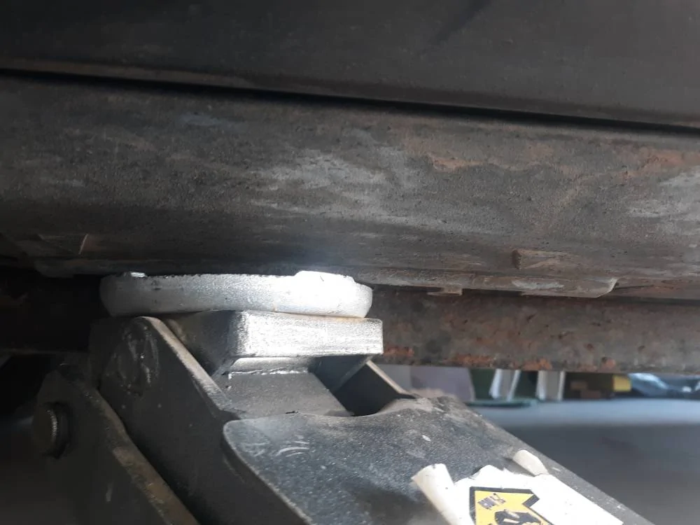 Ford Mustang Mach-E HowTo - modify Tesla Jack Lift Pads to protect MME battery rails 04 installed w lift