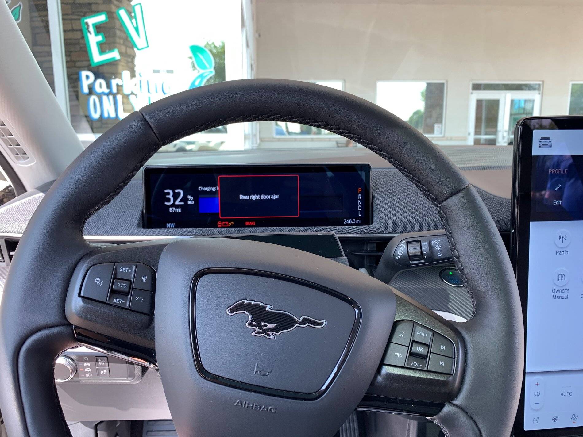 Ford Mustang Mach-E Mach-E 4x (Star White / Gray Interior) sighted at Phoenix dealership, with a look at range figures Dash