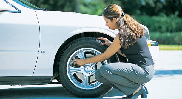 Ford Mustang Mach-E Tires could be costing EV owners an extra charge a year, study suggests checking-tire-pressure--aaa_100445874_m