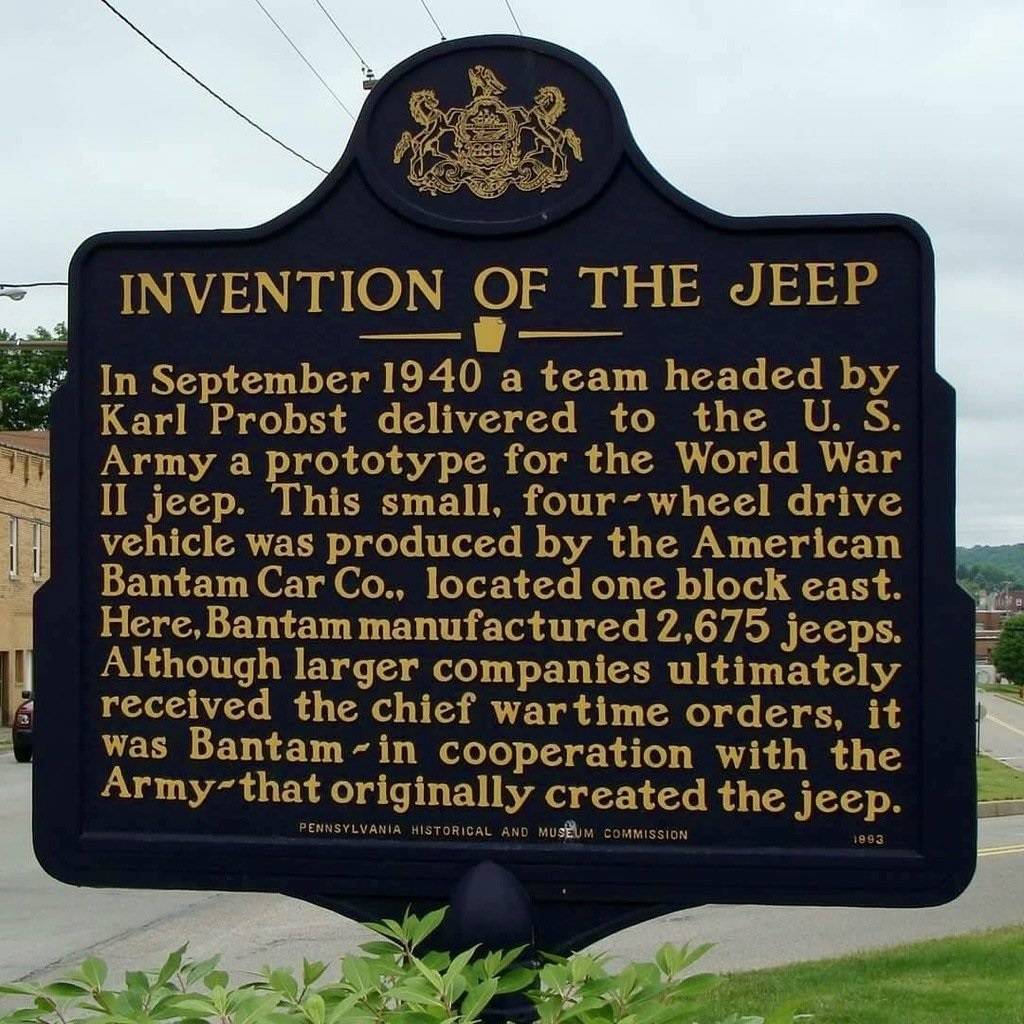 Ford Mustang Mach-E Tesla Supercharger Network vs. the World Jeep sign at buter pa