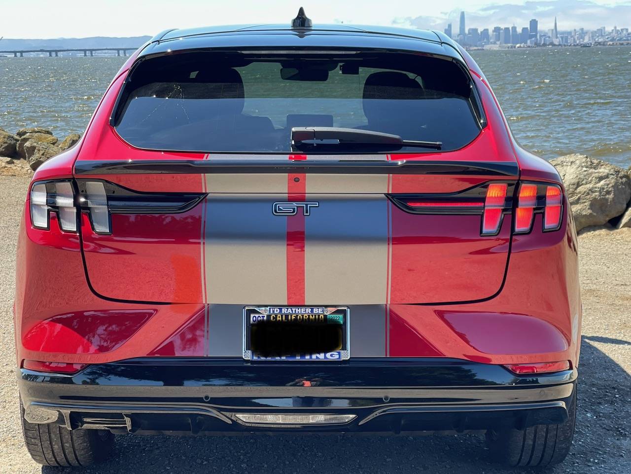 Ford Mustang Mach-E Dark Satin Grey stripes and AOSK gloss black spoiler on Rapid Red GTPE IMG_0324