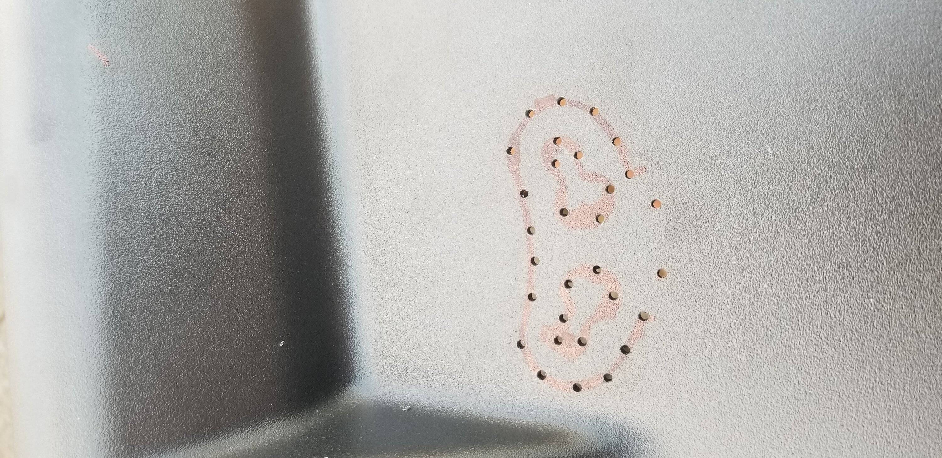 Ford Mustang Mach-E Radar Detector Mounting - trying to come up with a solution. Tiny drilled holes on the radar detector mount's outline - these will take the safety wire loo