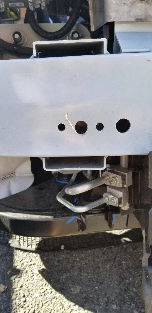 Ford Mustang Mach-E DIY - How to install a front tow ring at the front bumper knockout cover. Tow ring - naked bumper with drilled holes