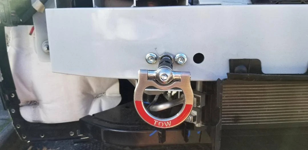 Ford Mustang Mach-E DIY - How to install a front tow ring at the front bumper knockout cover. Tow ring - backing plate installed and bolted
