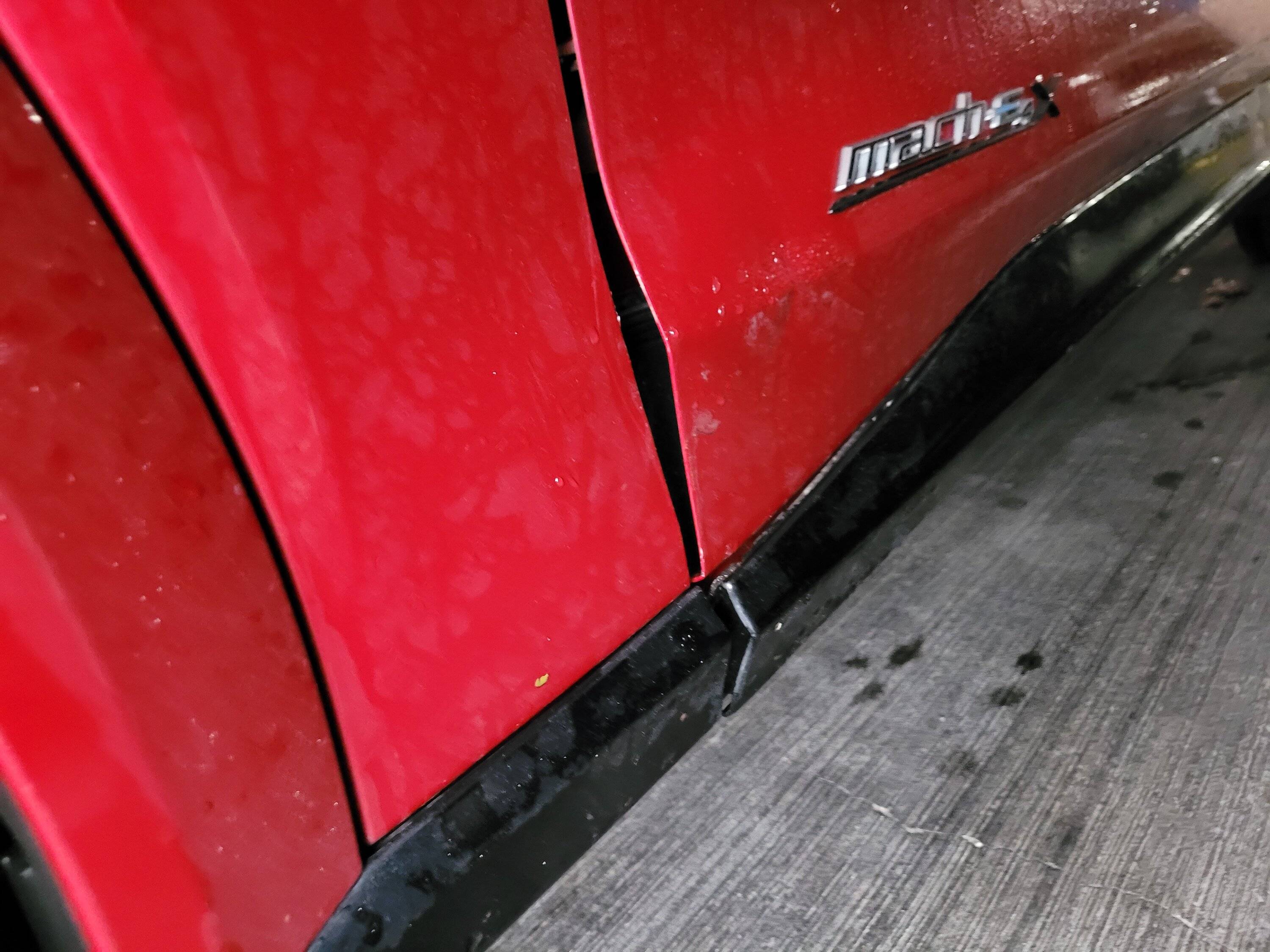 Ford Mustang Mach-E Damaged from jack slipping off lift rail 20230110_150416