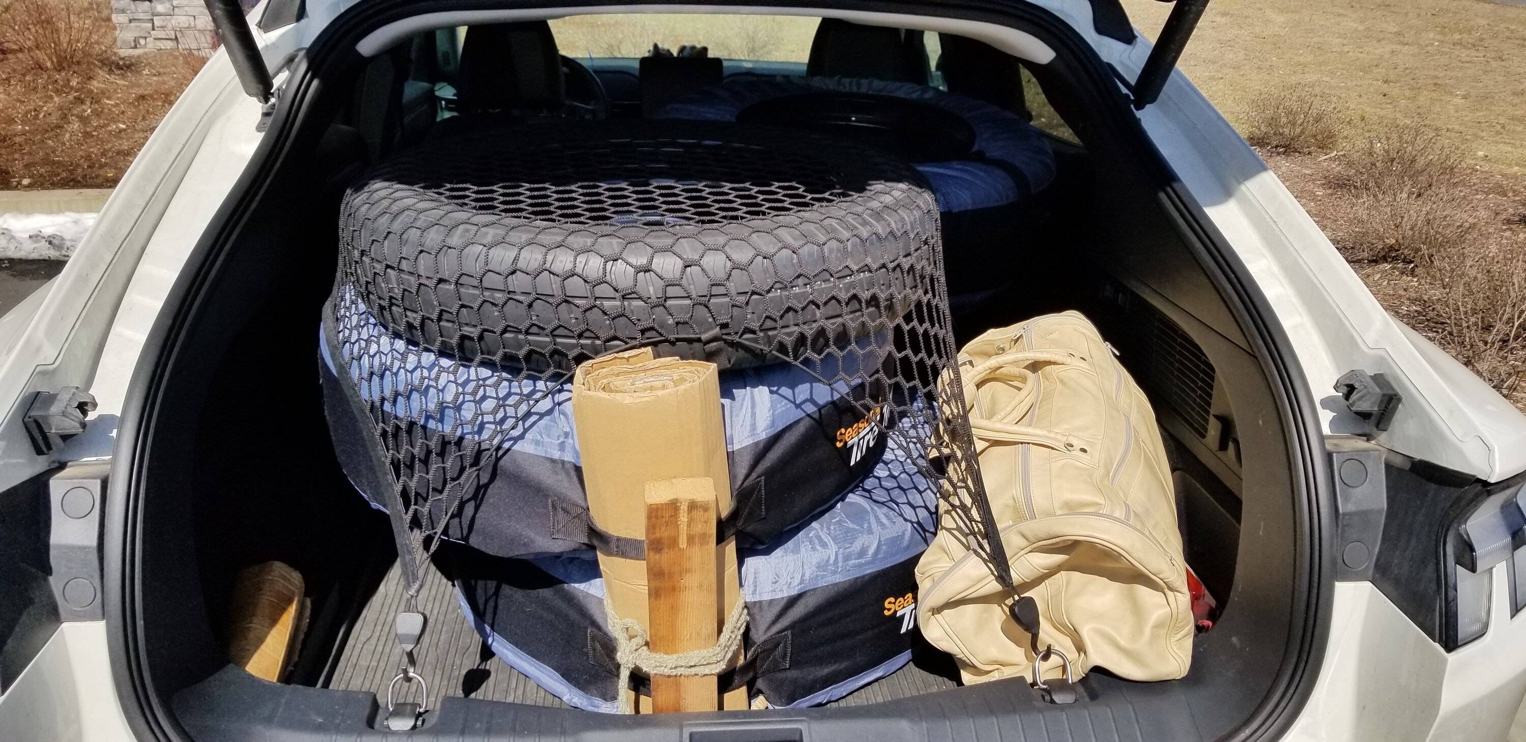 Ford Mustang Mach-E Finally found a cargo net that works!! Audi cargo net - holding three wheels+tires in Mach E trunk