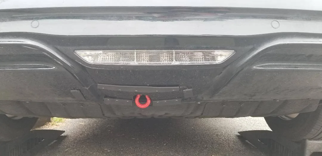 Ford Mustang Mach-E Draw-Tite Hidden Hitch install -- what do I do with my hidden bumper hole?  (3D printing design anyone?) Tow hitch cover - from lower rear looking forward, on ramps
