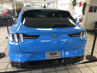 Ford Mustang Mach-E Mach-E on Display at Some Dealers Now MachE Grabber Blue Dealership 1